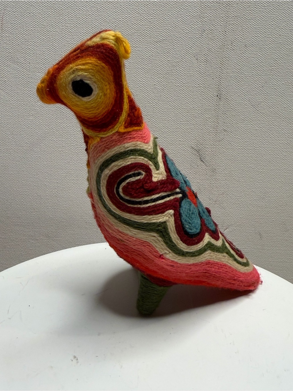 traditional bird figurine in the Huichol yarn art style